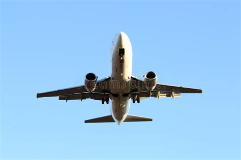 White Jet Airplane Flying Overhead Stock Image Image Of Boeing