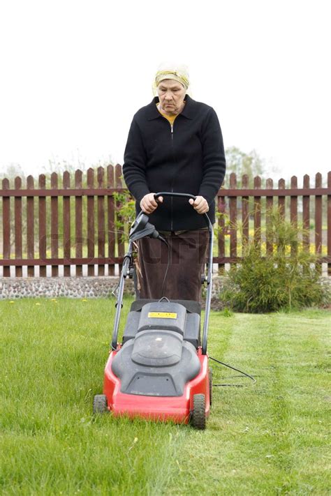 Old Woman Mowing Grass Stock Image Colourbox