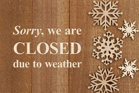 Sorry We Re Closed Due To Weather Message On A Wood Sign Stock Image