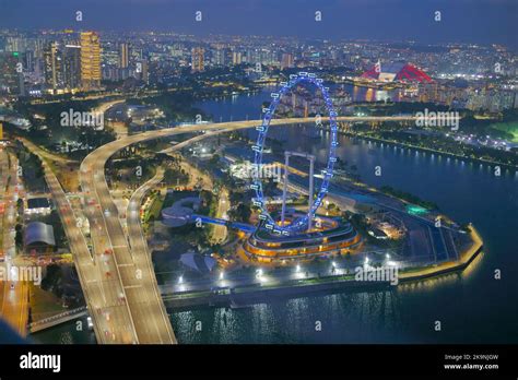 Singapore june 11 , 2022: Aerial view of singapore flyer at night Stock ...