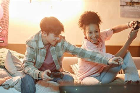 Premium Photo Two Young Friends Playing Videogames Together