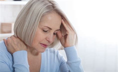 Premium Photo Woman Suffering From Stress Or A Headache Grimacing In