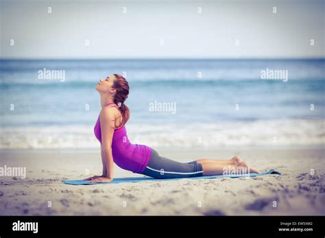 Brunette Doing Yoga On Exercise Mat Stock Photo Alamy