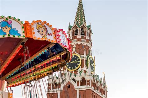 Spasskaya Tower Of Kremlin And Merry Go Round Carousel On Red Square In