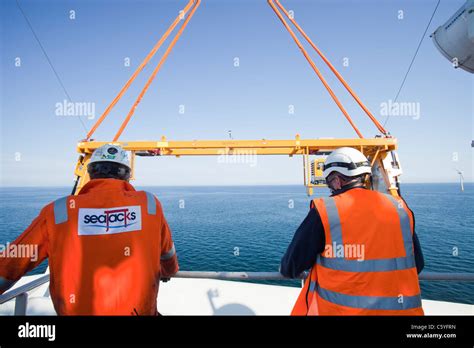 A Turbine Blade Being Lifted Off A Jack Up Barge To Fit Onto A Wind