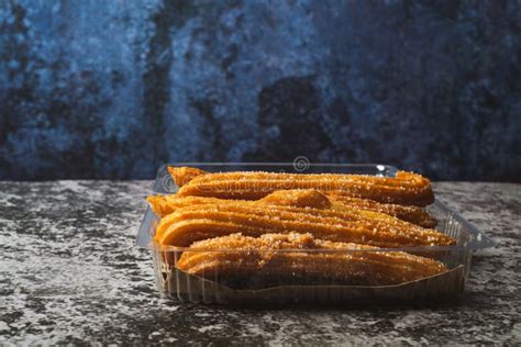 Churros In A Plastic Container On A Cement Table Stock Image Image Of