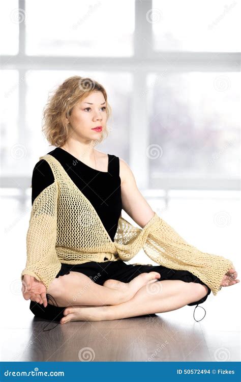 Serene Yogi Female Resting In Cross Legged Yoga Pose Stock Photo