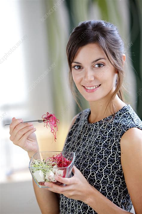 Woman Eating Sprouts Stock Image C Science Photo Library