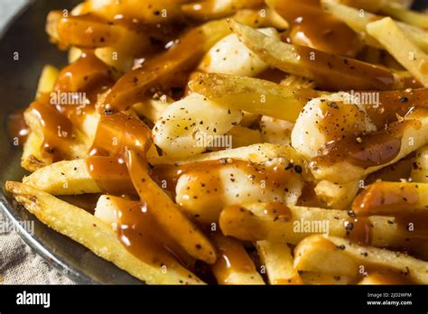 Homemade Cheesey Poutine French Fries with Gravy and Cheese Curds Stock ...