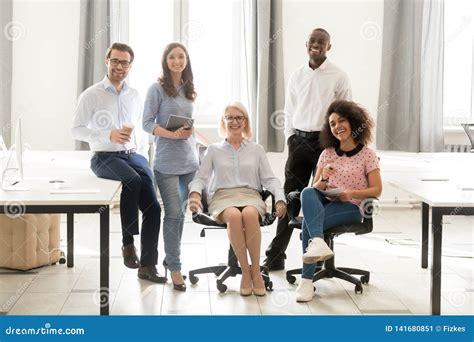 Diverse Happy Staff Employees Group Posing For Portrait In Office Stock