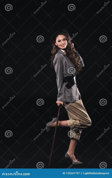 Fashionable Brunette Woman Posing With Walking Stick And Smiling At