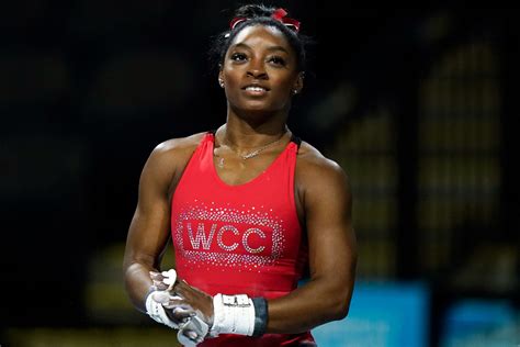 See Simone Biles Practice Uneven Bars for First Meet Since Tokyo Olympics