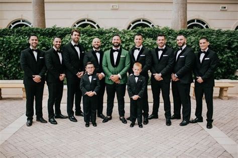 Groom In Emerald Green Tuxedo Jacket Bow Tie Groomsmen In Velvet Tux