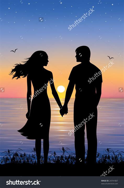 Silhouettes Of Man And Woman Standing And Holding Hands At Evening Time