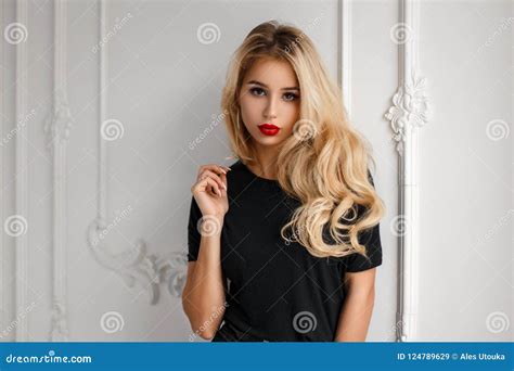 Stylish Young Fashionable Blond Woman With A Hairdo In A Trendy Stock