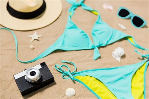 Premium Photo Bikini Hat Camera And Sunglasses On Beach Sand