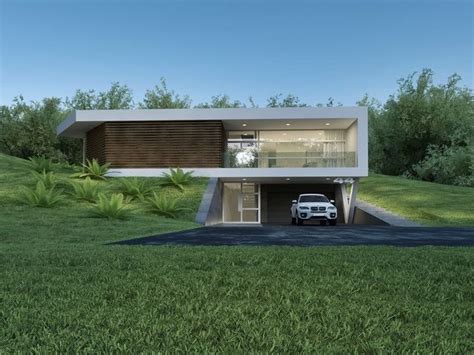 A White Car Is Parked In Front Of A Modern House With Grass And Trees