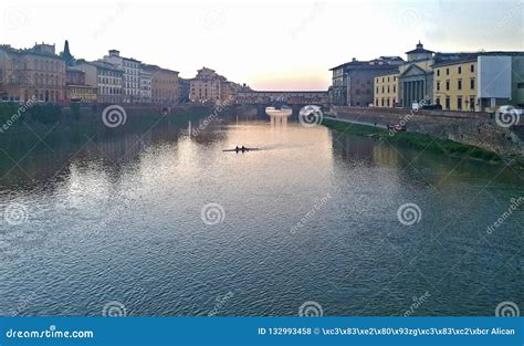 A Night And Day View Of Famous Ponte Vecchio Bridge On The Arno River