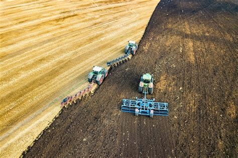 Premium Photo Aerial View Of A Tractor Plowing Black Agriculture Farm