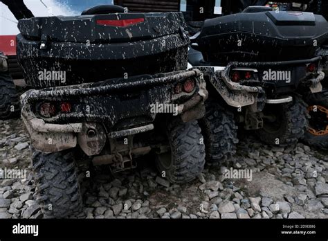 Back View Of Two Dirty Muddy Quad Bikes Off Road Extreme