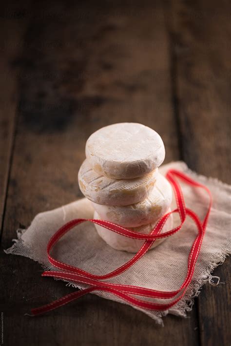 A Stack Of Tomini Cheese Del Colaborador De Stocksy Laura Adani