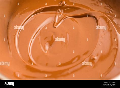 Background Of Melted Milk Chocolate Stock Photo Alamy