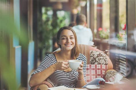 Young Woman Sitting Indoor In Urban Cafe Stock Image Image Of