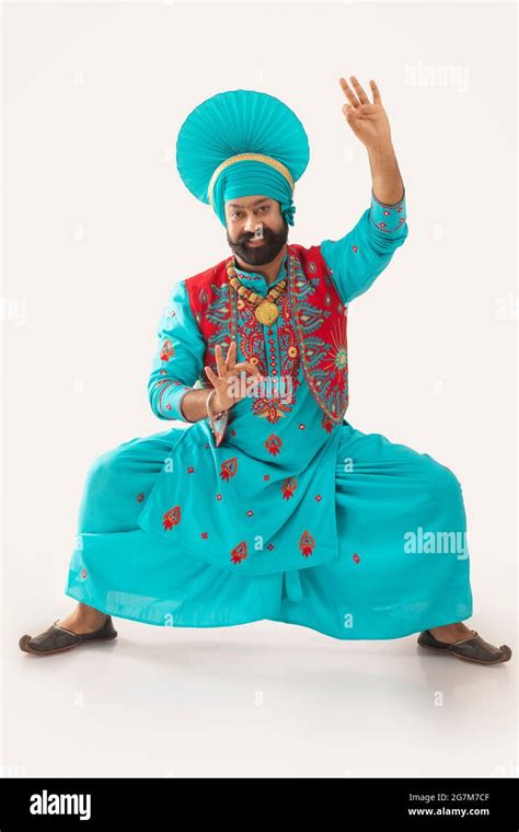 A Bhangra Dancer illustrating a dance step with hands gestures Stock ...