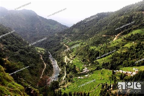 A scenic valley with small villages along the Broat River in Himachal ...