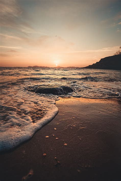 Sunset Sea Beach Rocks Waves Hd Phone Wallpaper Peakpx