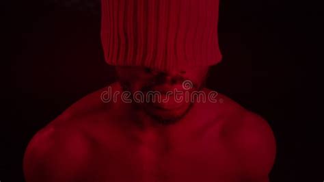 Black Guy With Naked Torso Smokes It Emits Smoke From Which Various Figures Are Formed Stock