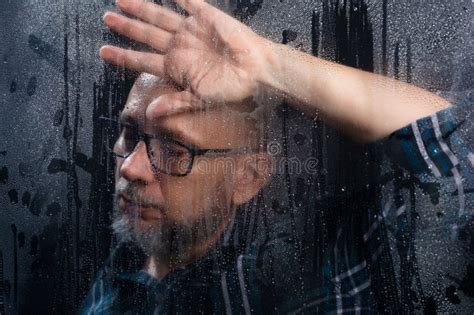 Close Up Portrait Of Bald Bearded Man Wearing Prescription Glasses