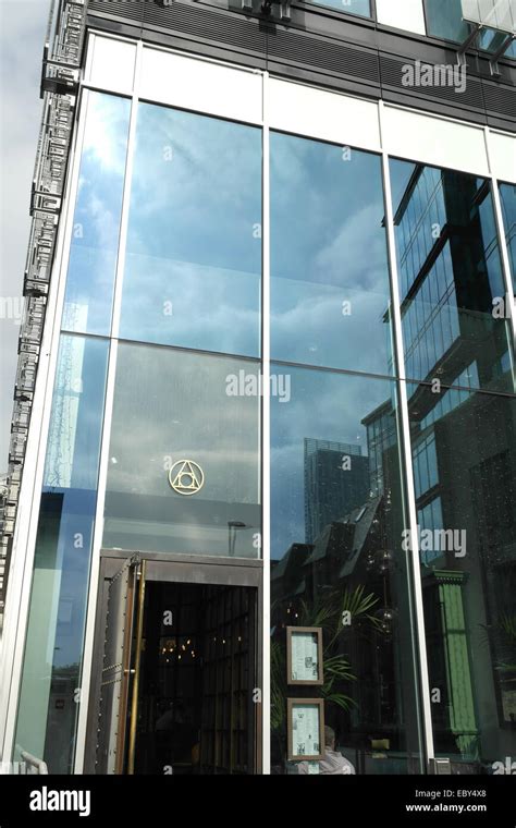 Sunny Portrait Tall Glass Windows With Cloud And Building Reflections Alchemist Bar 3 Hardman