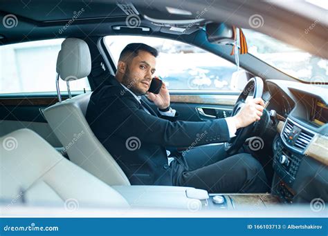 Side View On Man Driving Car And Talking On Phone Stock Image Image