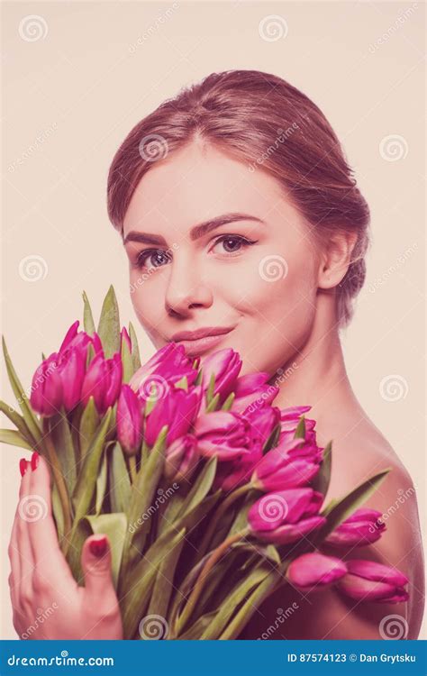 Closeup Portrait Of Pretty Women Holding Bouquet Of Tulips Stock Image