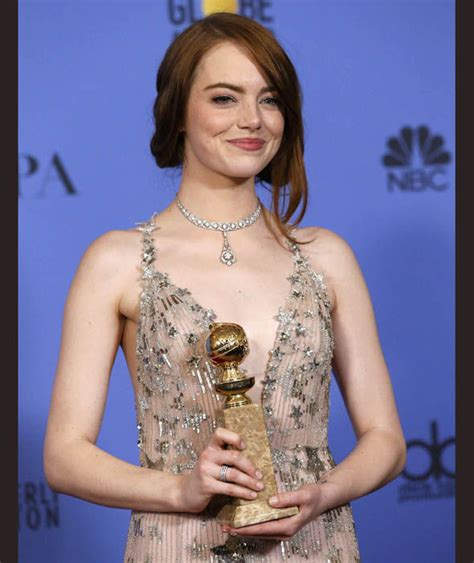 Emma Stone Poses With Her Award For Best Performance By An Actress In A Motion Picture Musical