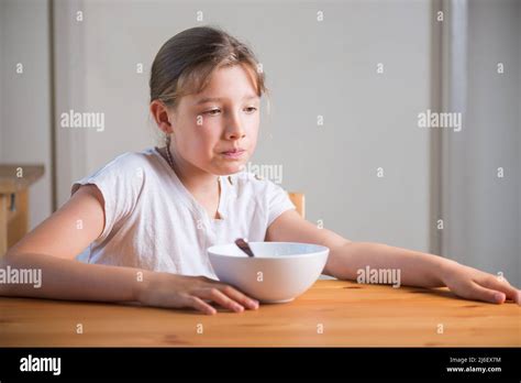 Blonde Teenage Girl Eating Cereal For Breakfast Lifestyle Portrait Stock Photo Alamy
