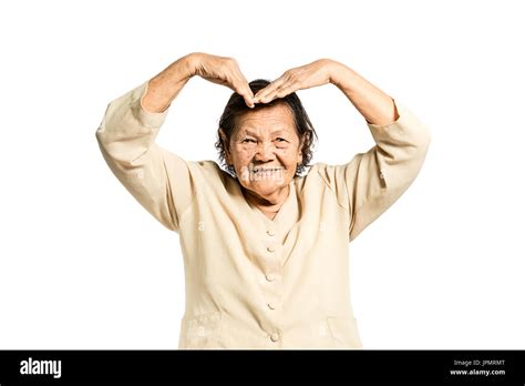 Portrait Of A Mature Woman Smiling And Showing Love Sign Hand Isolated On White Background With