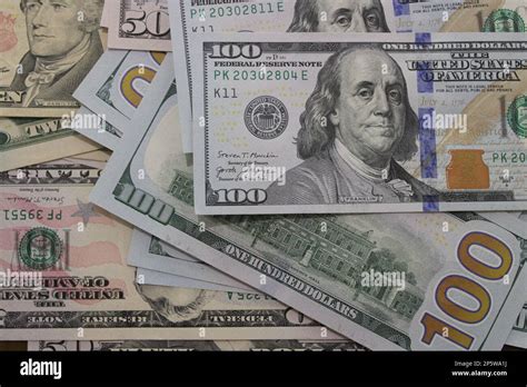 Pile Of Us Dollar Bills Of Varying Monetary Value Stock Photo Alamy