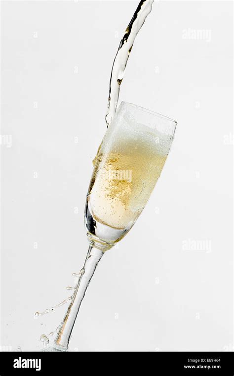 White Wine Splashing Out Of Glass Isolated On White Background Stock