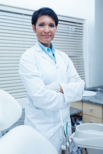 Premium Photo Portrait Of Smiling Female Dentist