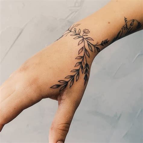 Tiny Flowers On A Hand By Jessica Rubbish Tattoogrid Net