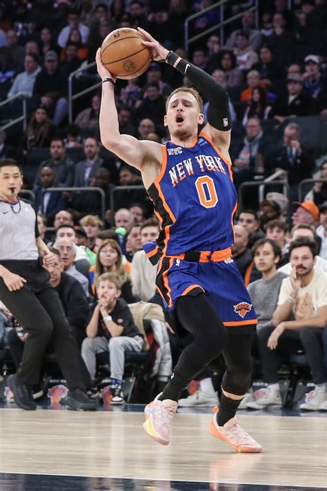 New York Knicks Guard Donte Divincenzo 0 Looks For An Open Teammate While Driving To The