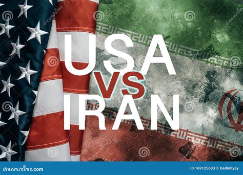 USA Vs Or Versus IRAN Inscription Over American Flag And Iranian Flag