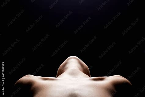 Shoulders Of A Naked Woman Nude Silhouette Under Light In The Dark Stock Photo Adobe Stock