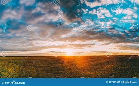 Sunset Sunrise Over Field Or Meadow Bright Dramatic Sky Over Ground