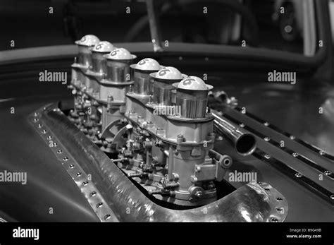 Carburetors Sticking Out Through The Hood Of A Hot Rod On Display At The Detroit Autorama Hot