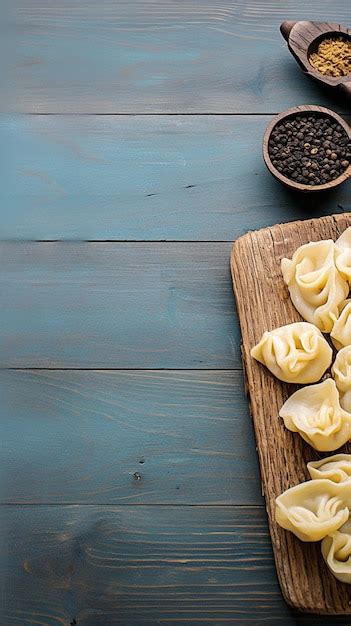 Premium Photo Savory Raw Pelmeni Dumplings Displayed On Wooden