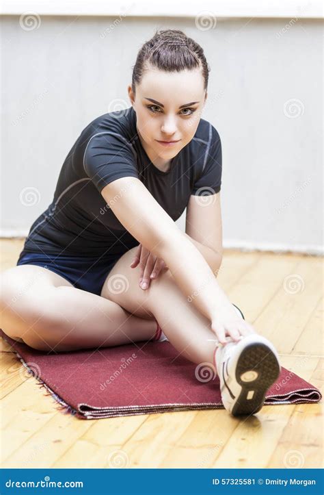 Sport Ideas And Concepts Fit Woman Stretching Her Leg To Warm U Stock