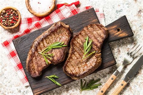 Grilled Beef Steak On Wooden Cutting Board Stock Photo Image Of Rare